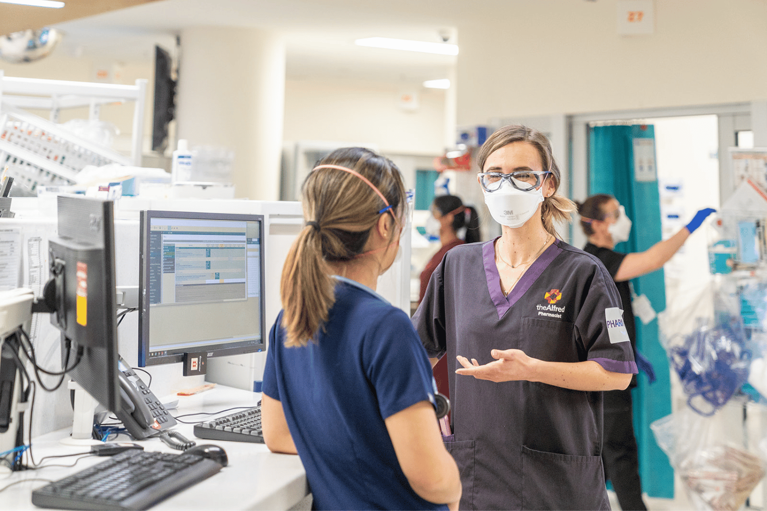 ICU_two_female_staff_at_pc.png